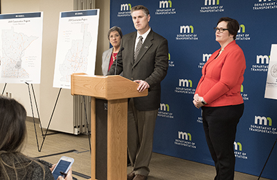 Metro District Construction Engineer Michael Beer listens to a media question at the construction and maintenance kickoff event April 4 at Central Office.Deputy Commissioner and Chief Engineer Sue Mulvehill is to his left, and Commissioner Margaret Anderson Kelliher is to his right.